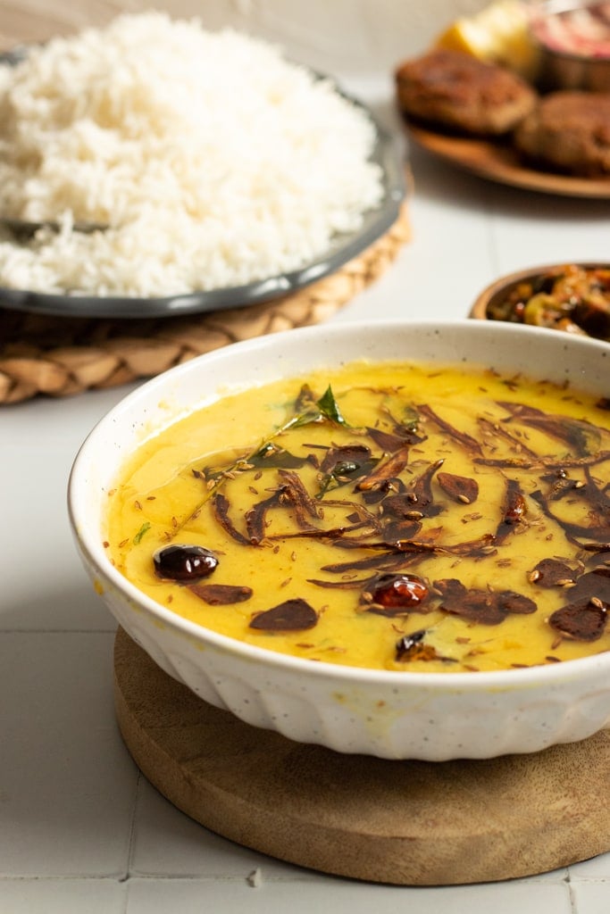 Moong ki daal in a bowl, rice in the background