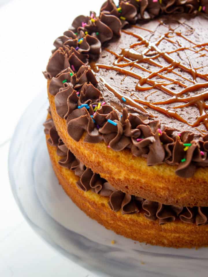 three quarters of a vanilla cake with chocolate buttercream