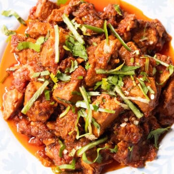 boneless chicken masala with a triangle of roti