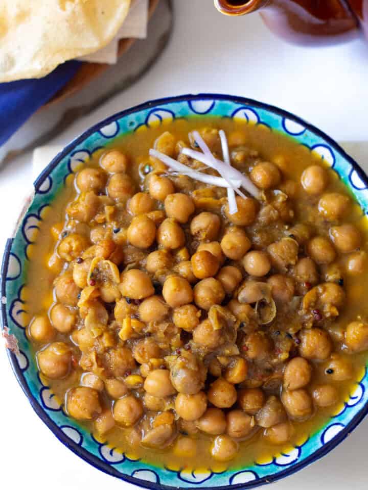 top down view of a plate of poori chana or puri chole