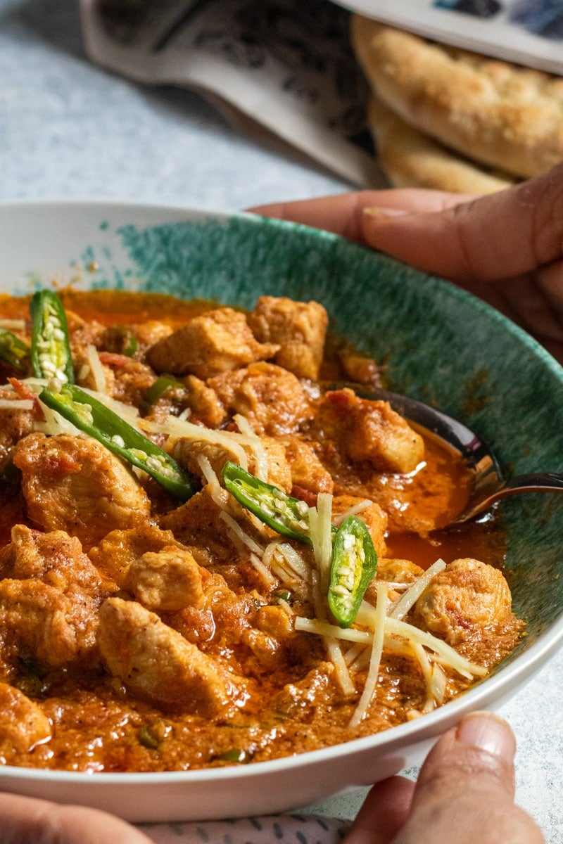 Chicken Ginger in a bowl held by two hands 