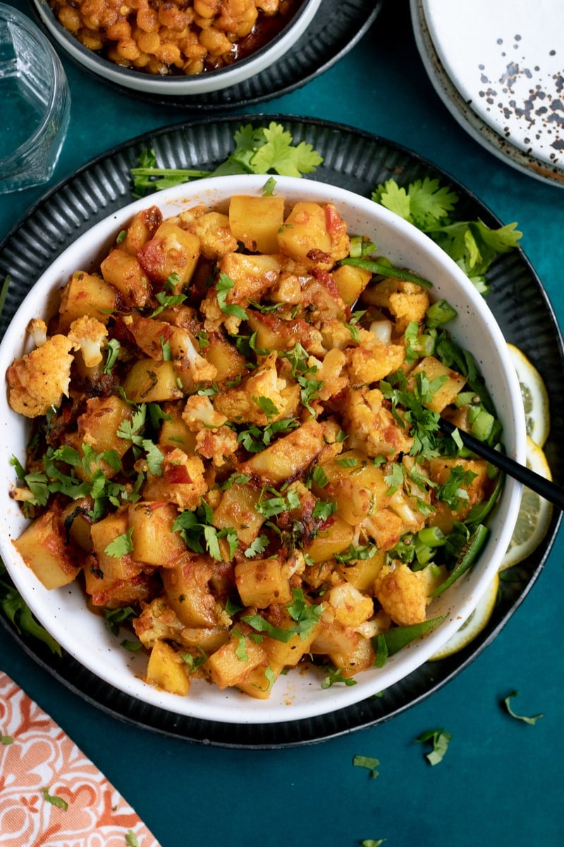 Aloo Gobi top down view, a plate underneath the dish of aloo gobi