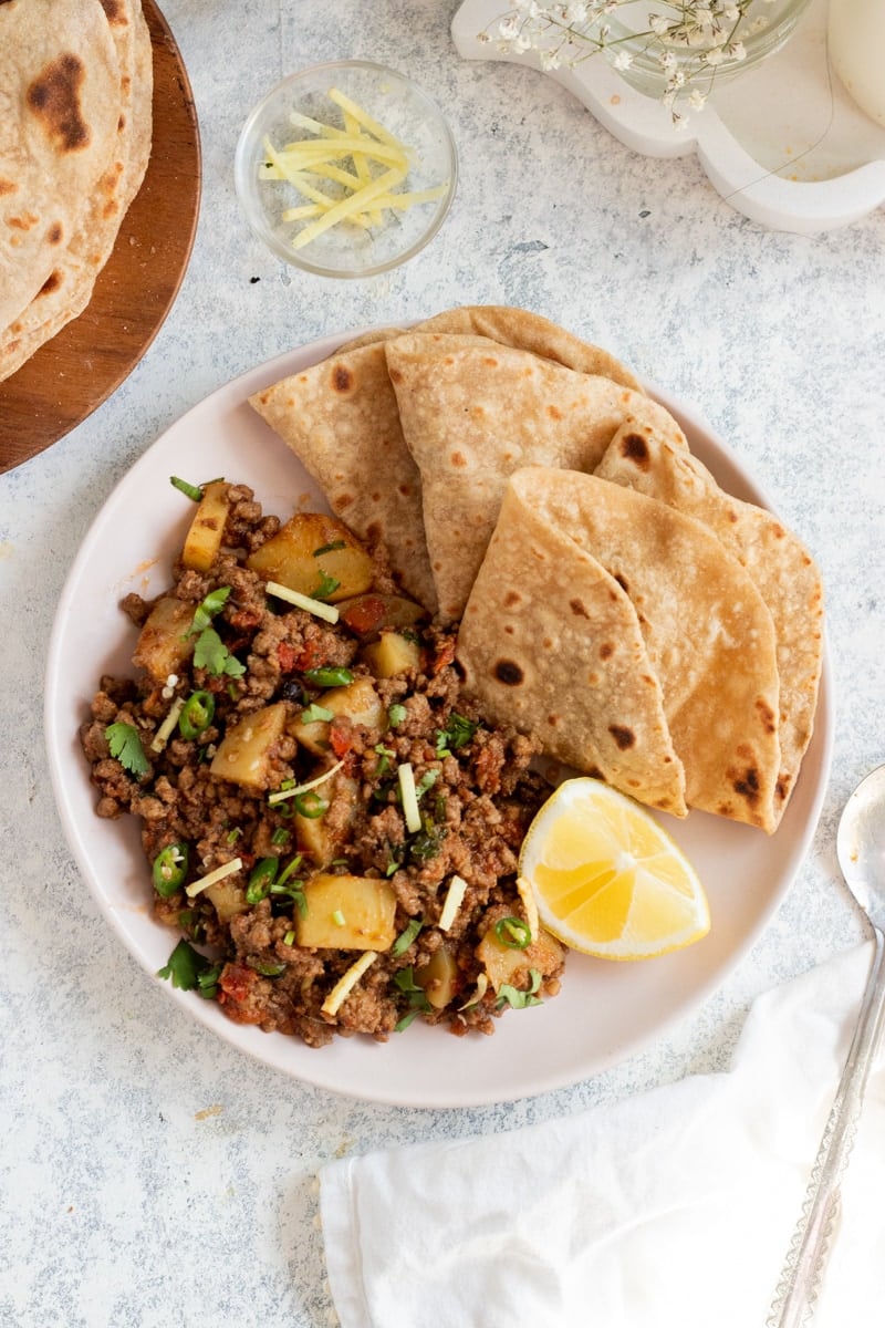 plate with aloo keema and chapatis