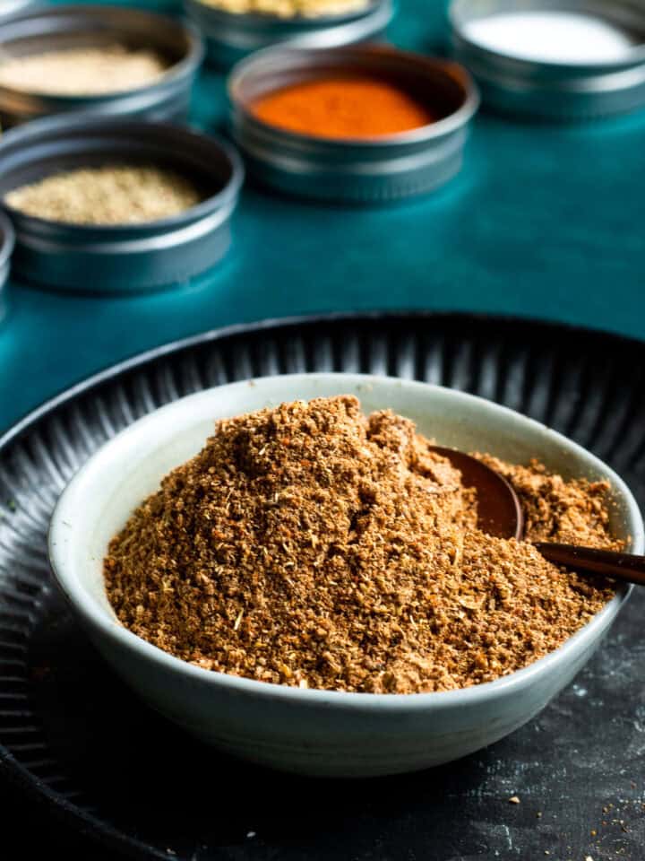 Pakistani Chaat Masala mix in a bowl, spices in background