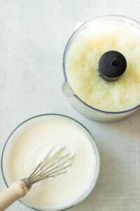 top down view of pureed onion and whisked yogurt