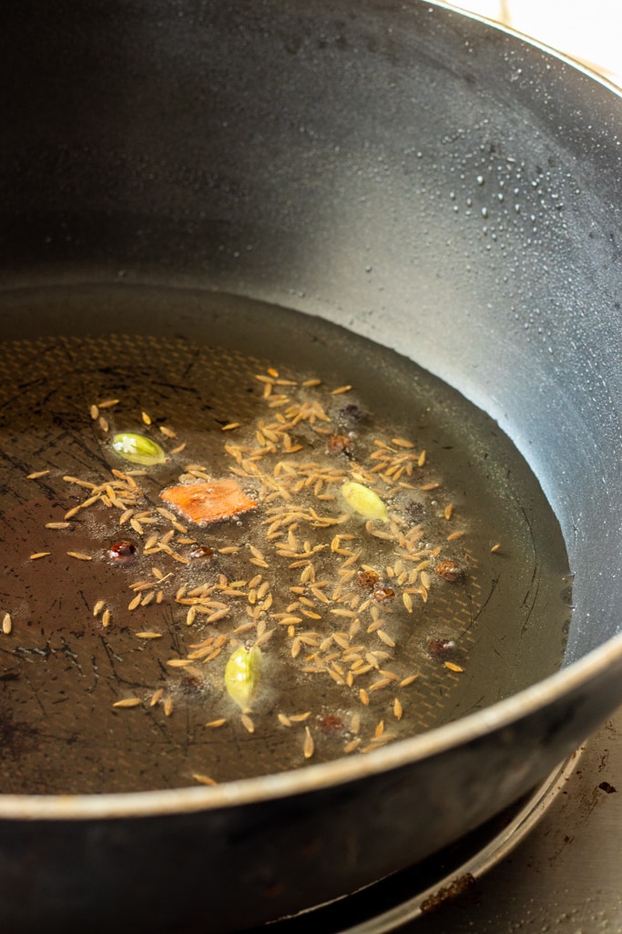 whole spices cooking in oil
