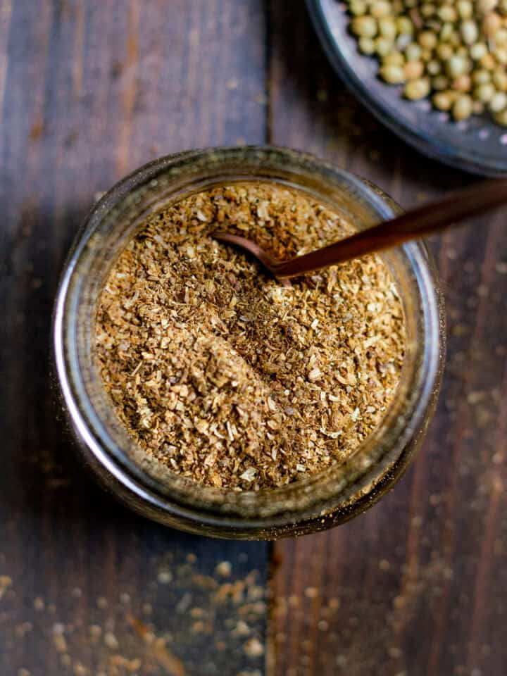 Freshly Toasted Dhania Powder in a jar with a spoon
