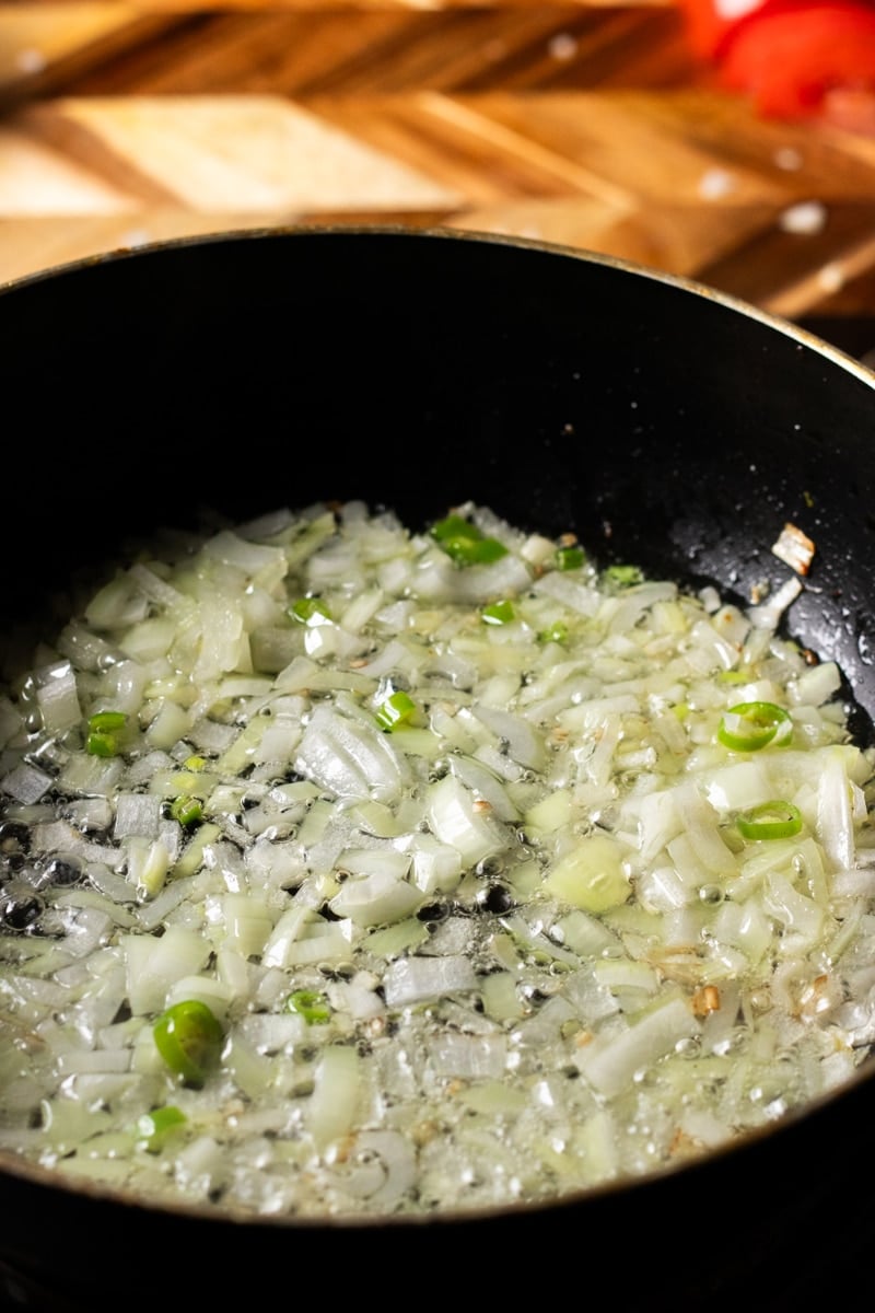 onions sauteeing in a pot
