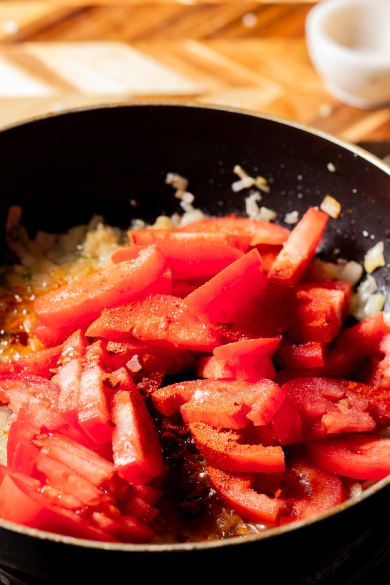 tomatoes and spices in a pan